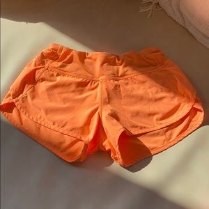 Neon orange Lululemon Speed Up Shorts 2.5
